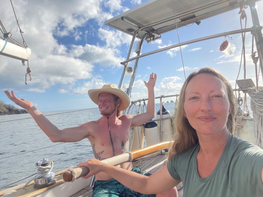 happy couple on sailboat