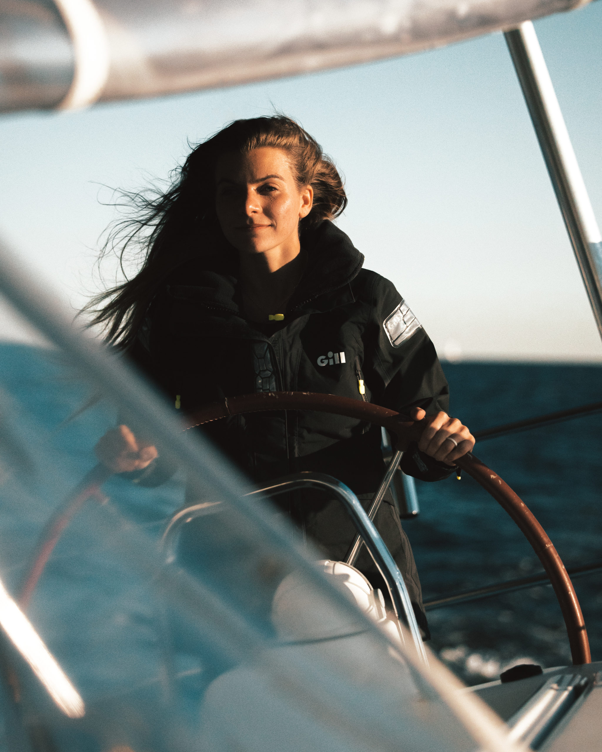 Jade Evans steering her sailboat