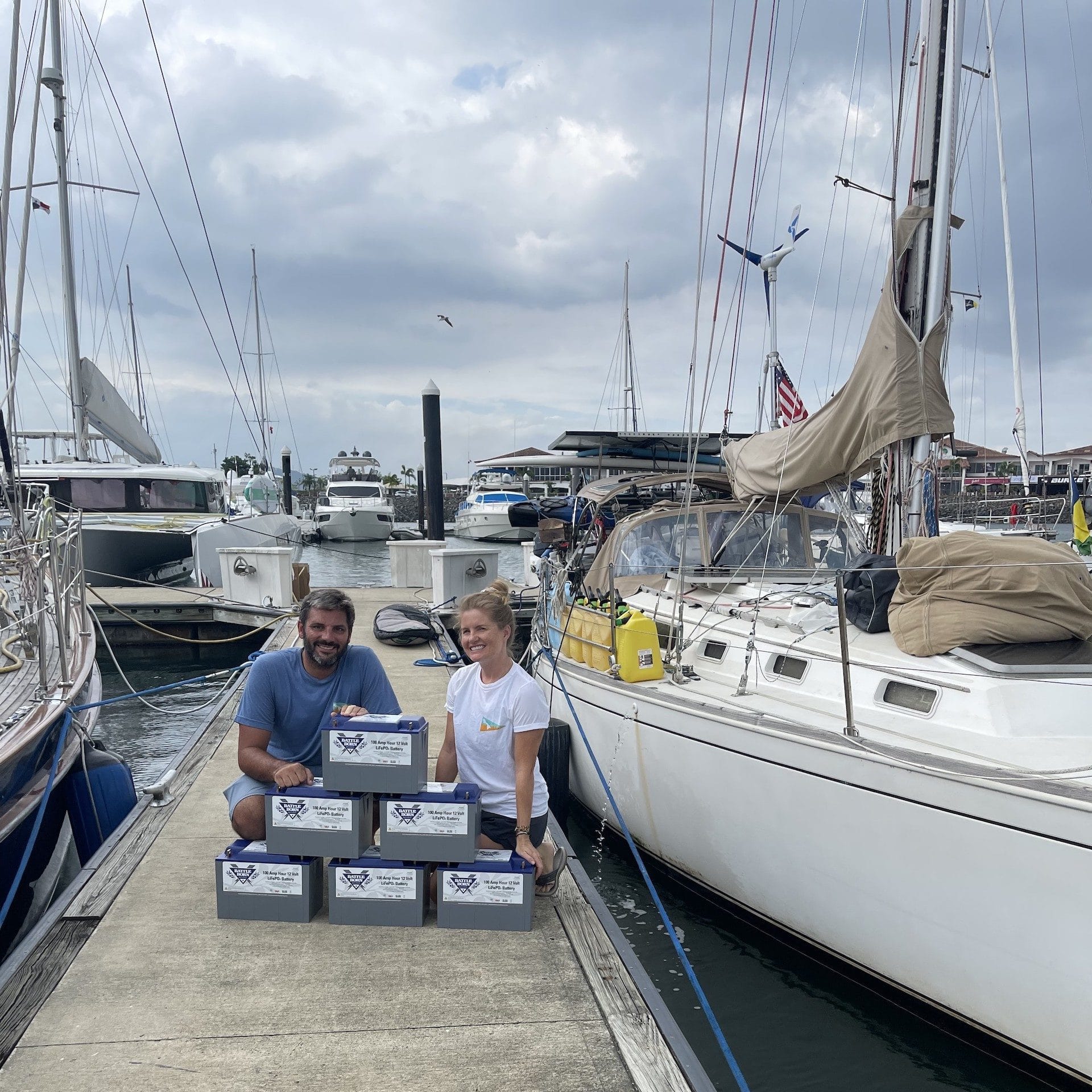 calico skies sailing with battle born batteries next to their sailboat