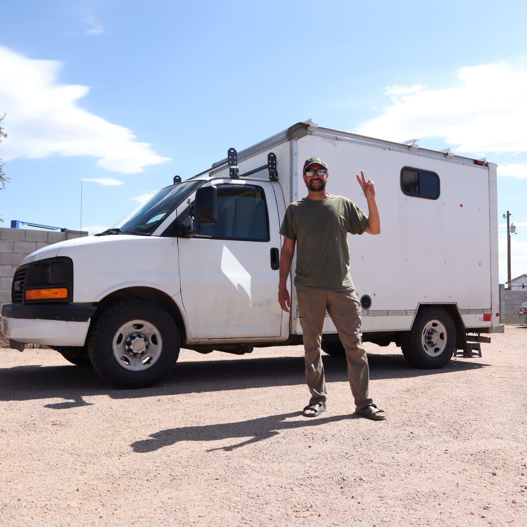 Adventure Van Man in front of his Box Truck Camper