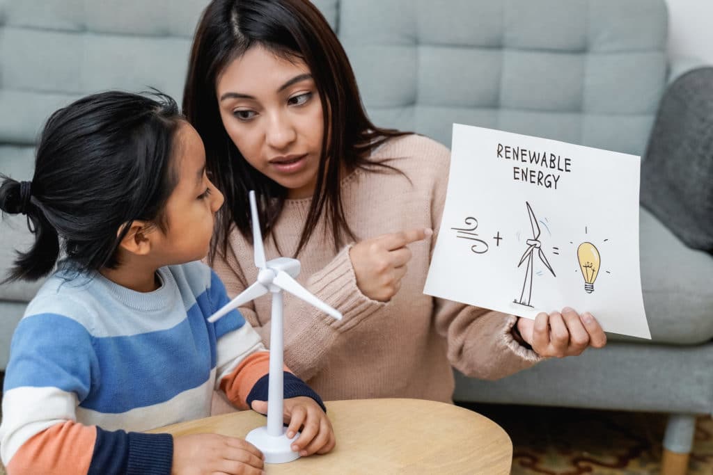 woman teaching child about renewable energy