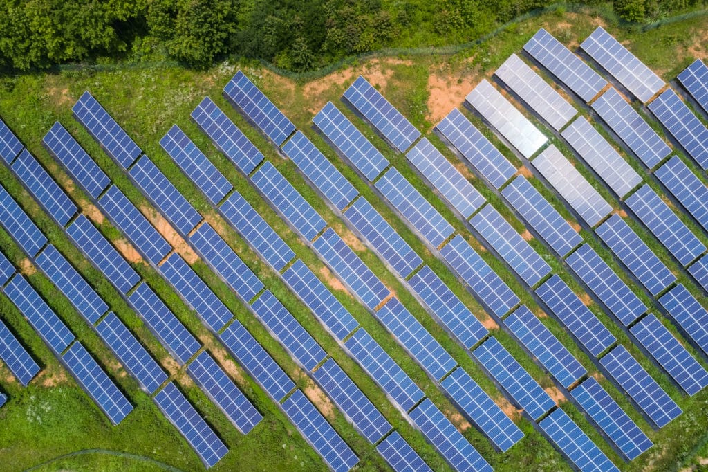 aerial view of solar panels for renewable energy on the hillside