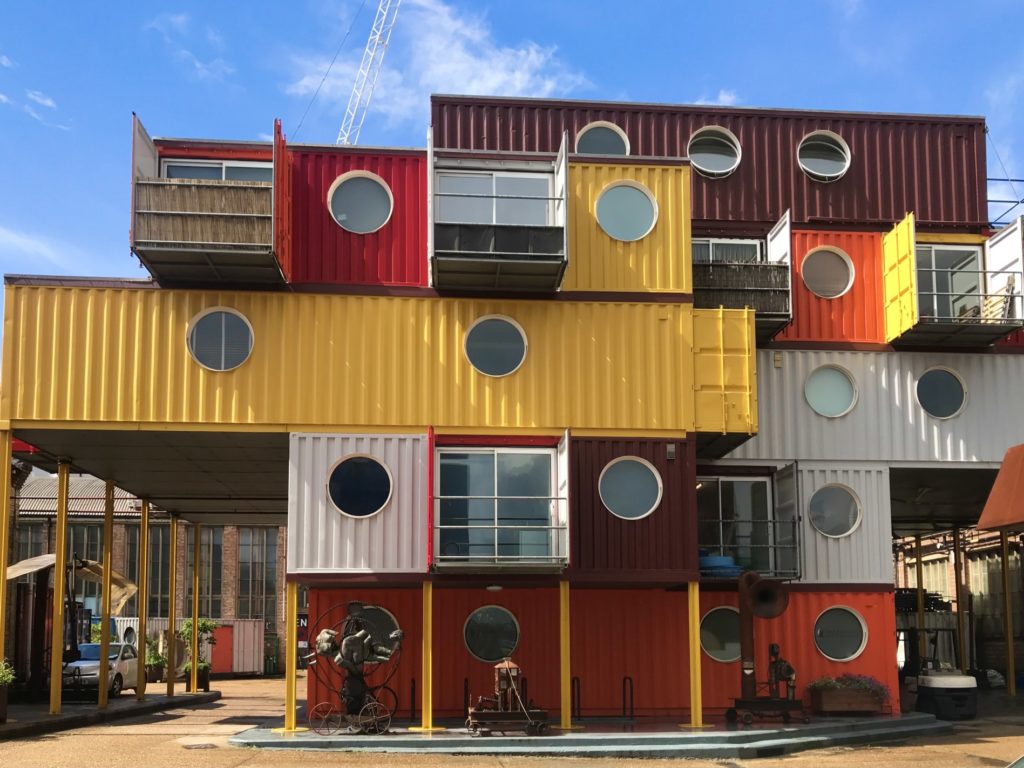 large container home with circle windows