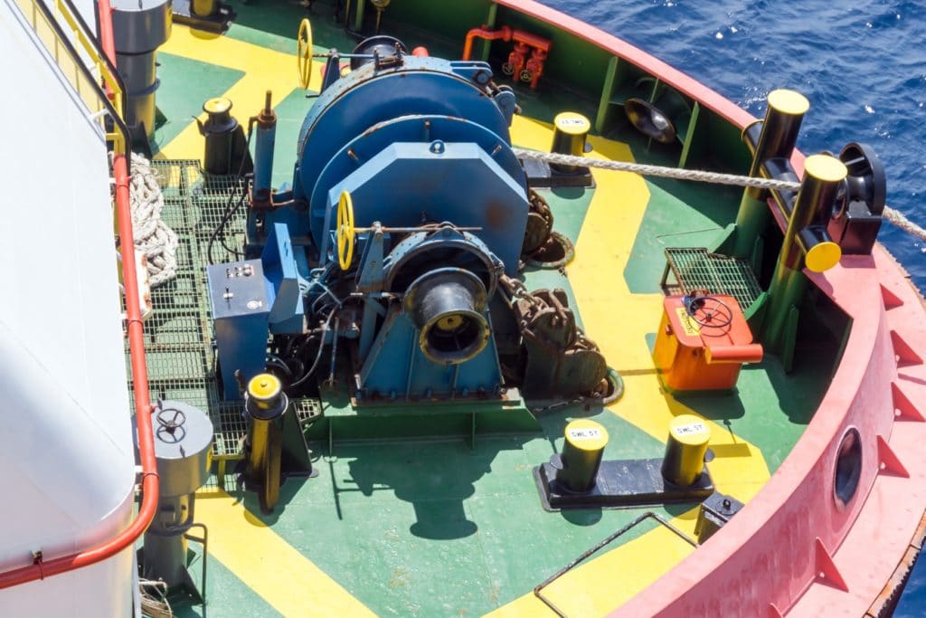 very large windlass on a ship that sits in a horizontal configuration taking up a lot of deck room