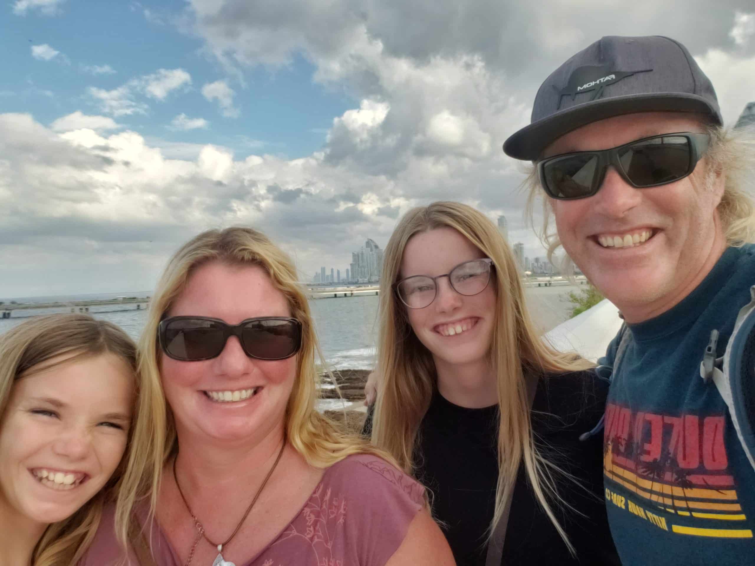 The Finley Family smiling on the beach for a selfie