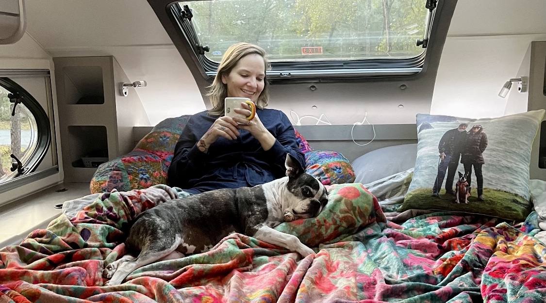 Irene Carey and Pup in the Truck Camper