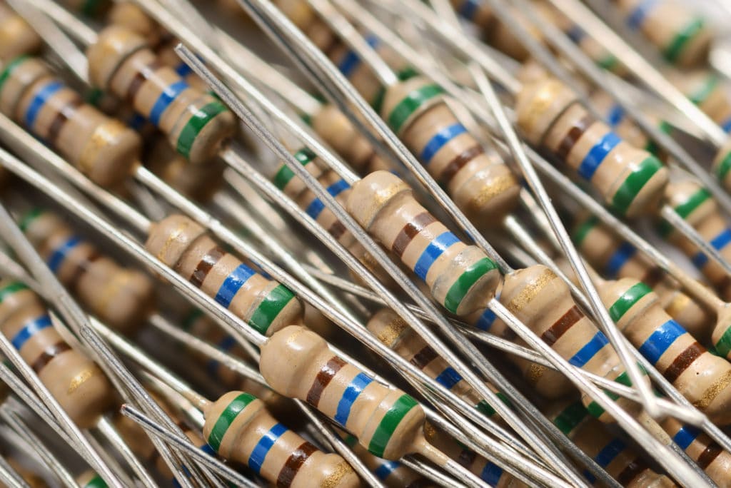 Heap of resistors electronic components macro shot background