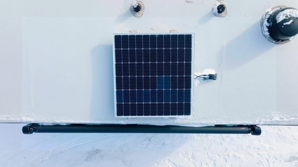 solar panel on top of an RV in the snow