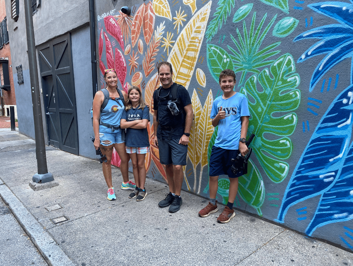 Grateful Glamper Family in front of a mural