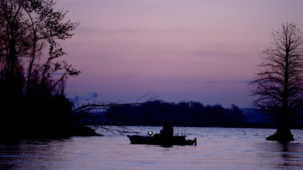 bass boat on Kentucky Lake during dusk