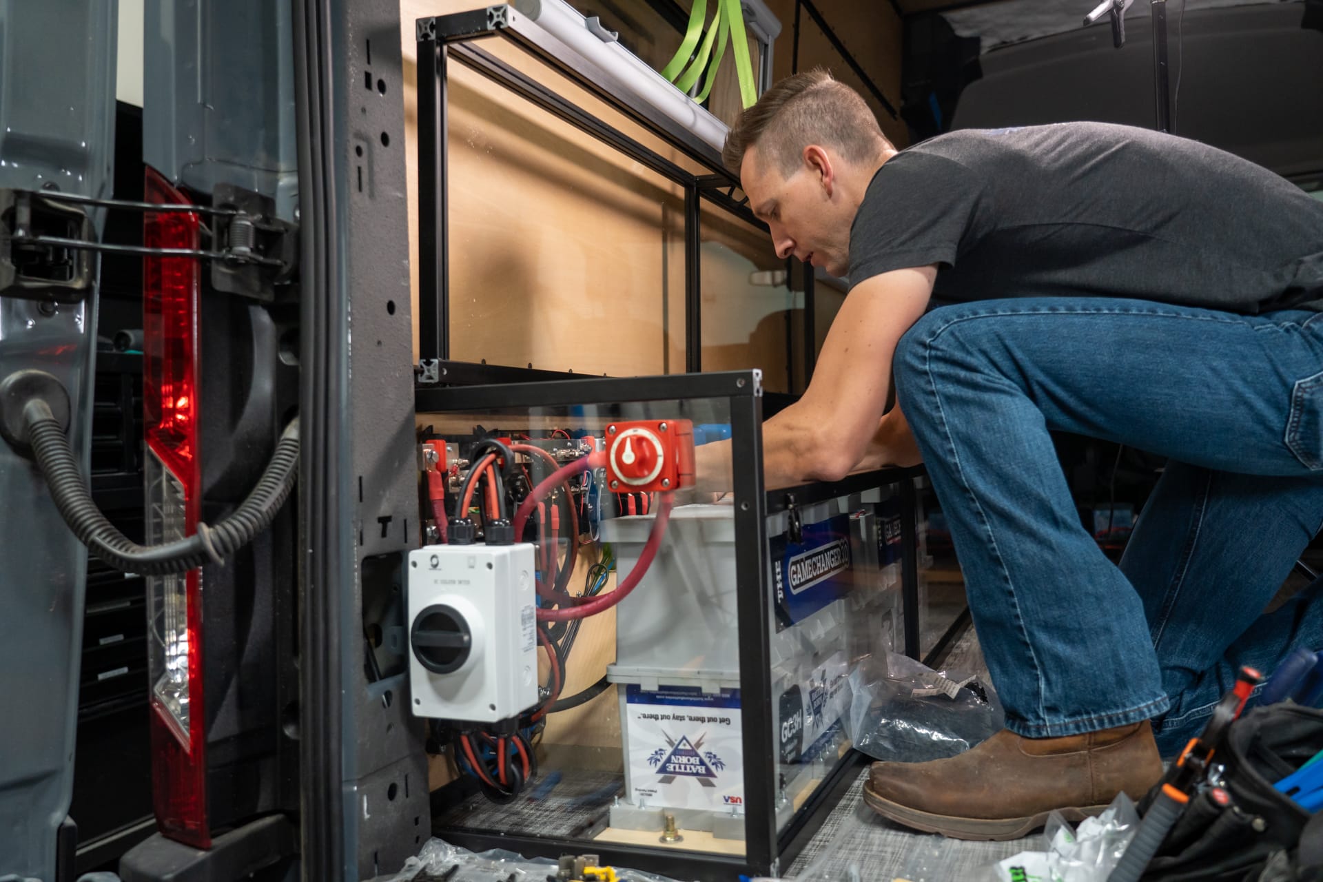 man working on a lithium electrical install