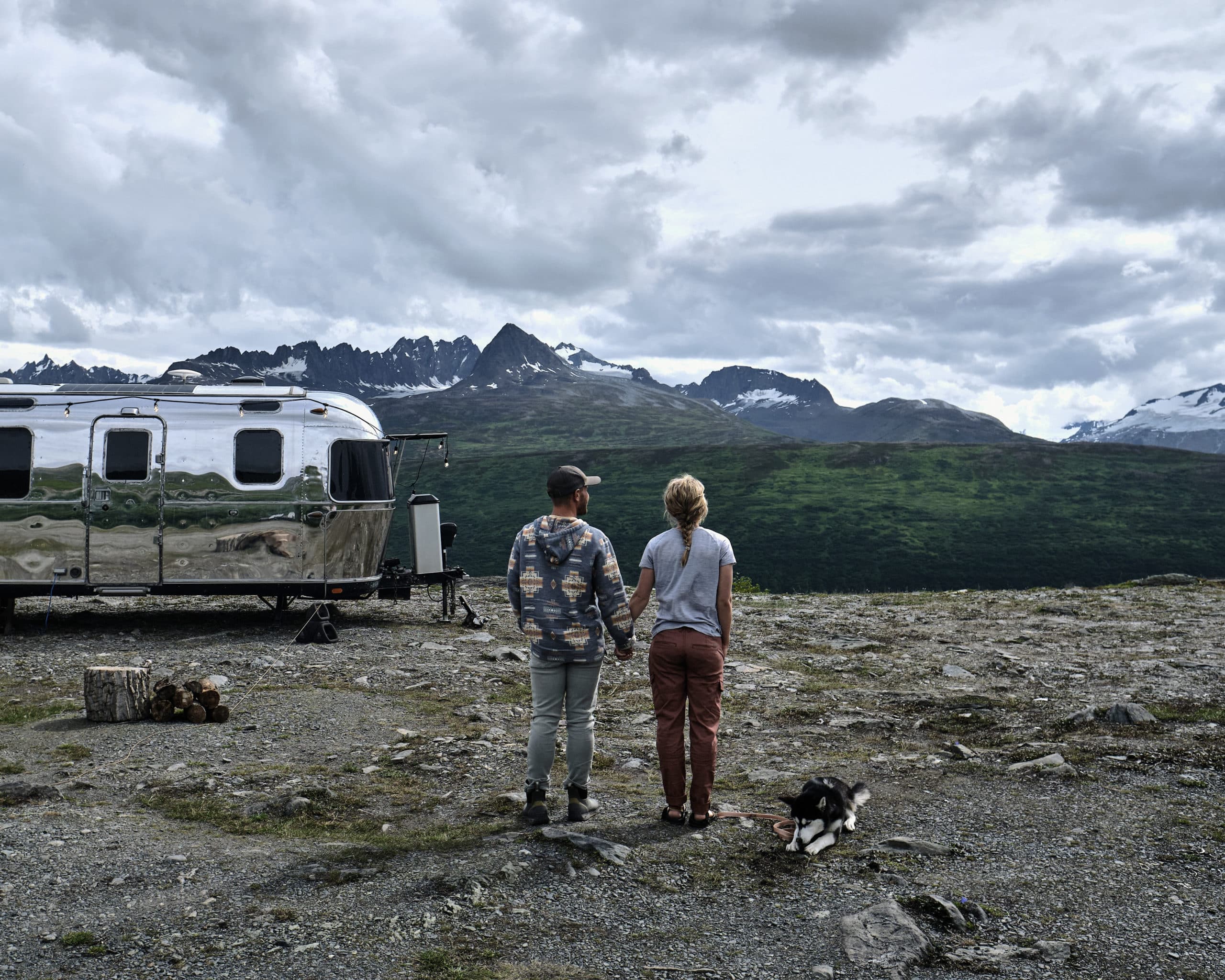 Kendall Strachan and Her Puppy in Front of Their Airstream in Alaska