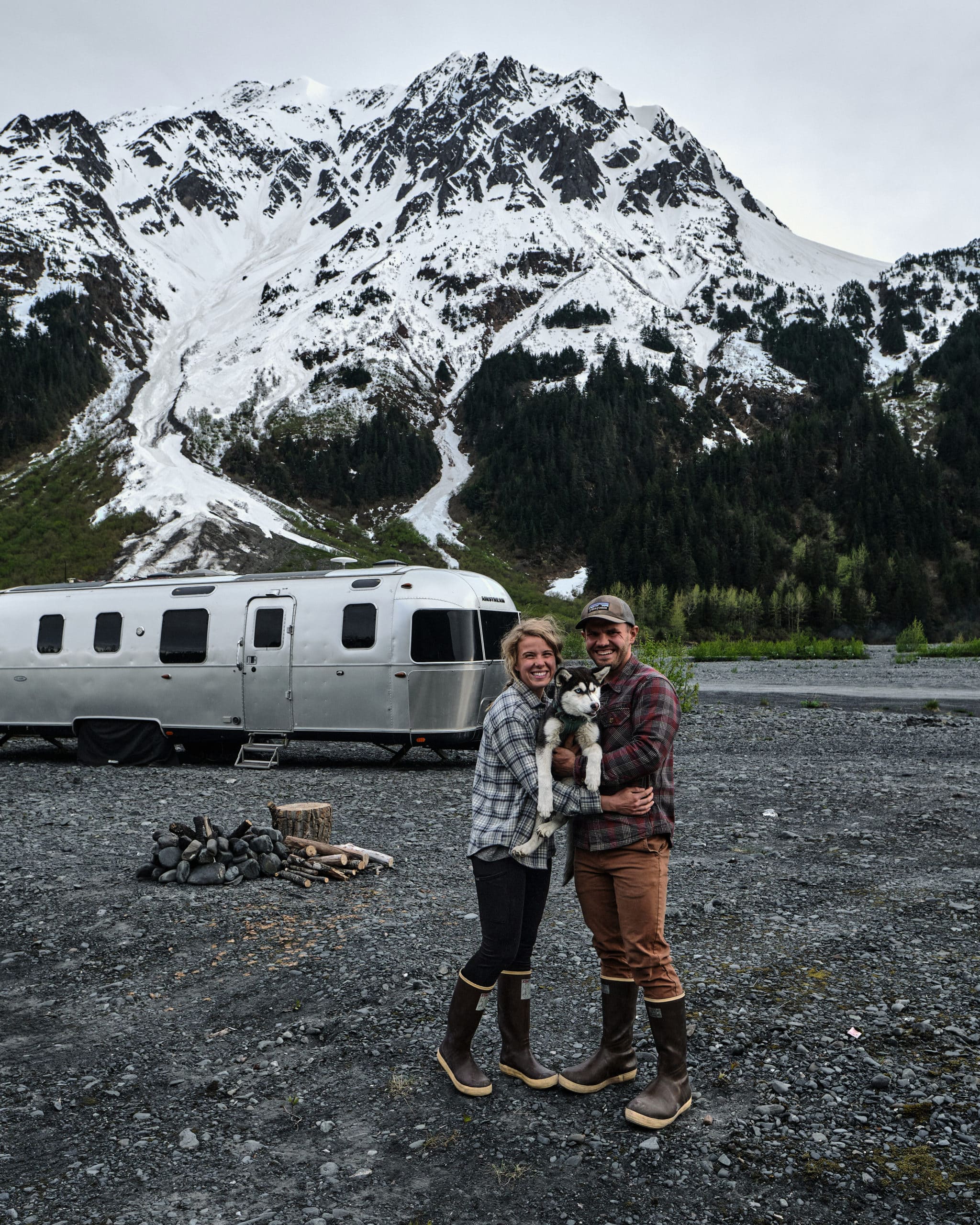 Kendall Strachan and Her Puppy in Front of Their Airstream in Alaska