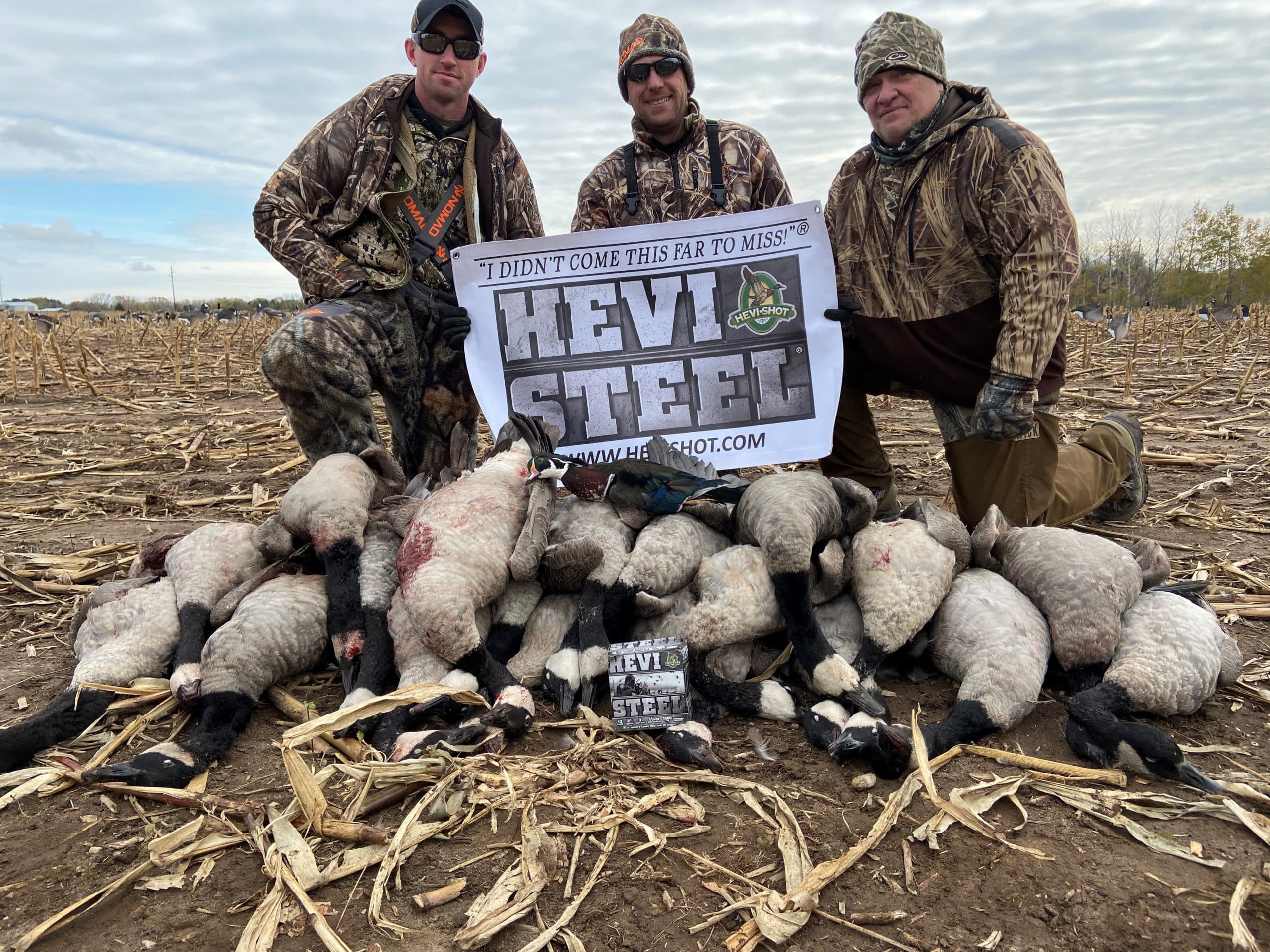 Honor and Valor men in front of a pile of geese that they hunted