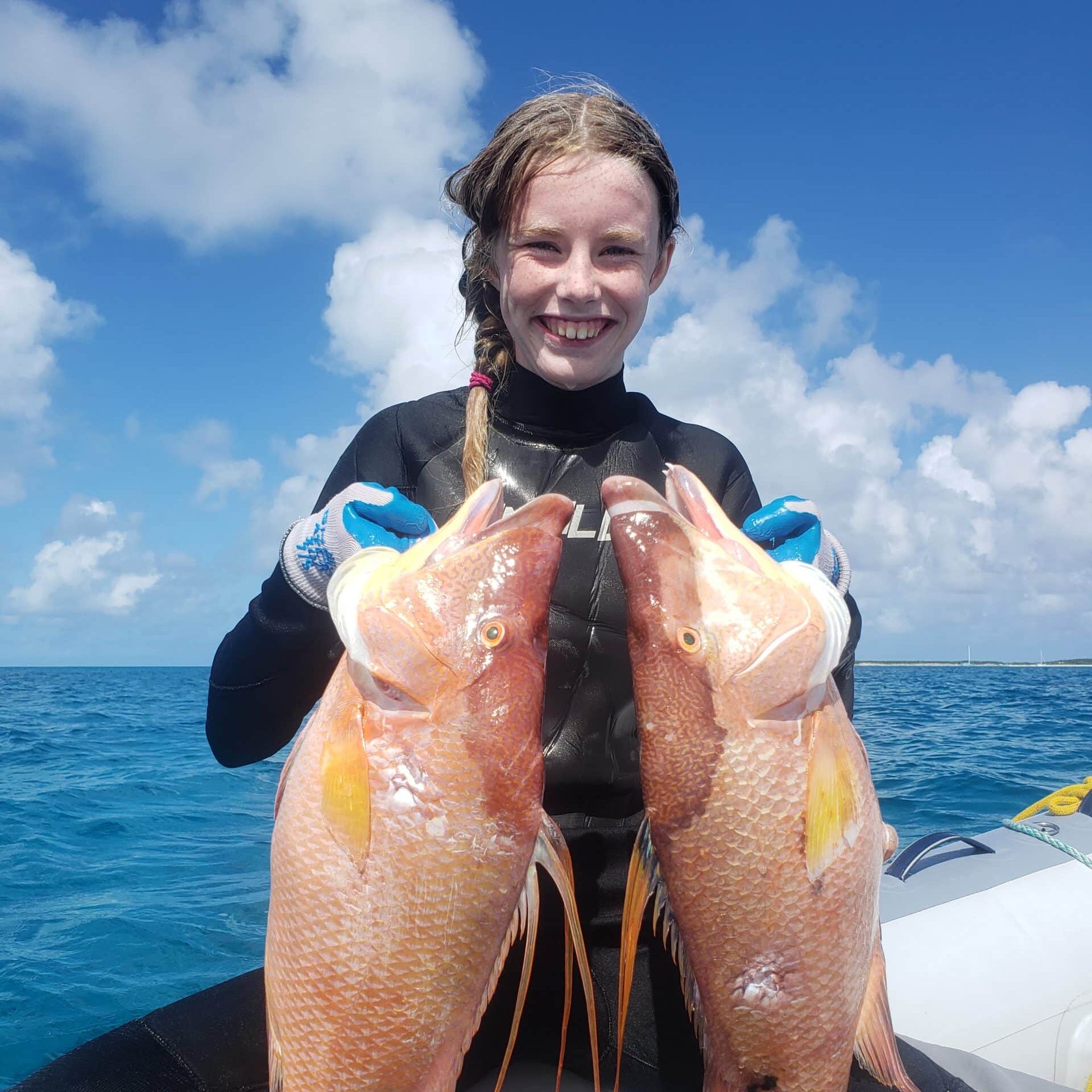 Isla Holding Two Hogfish