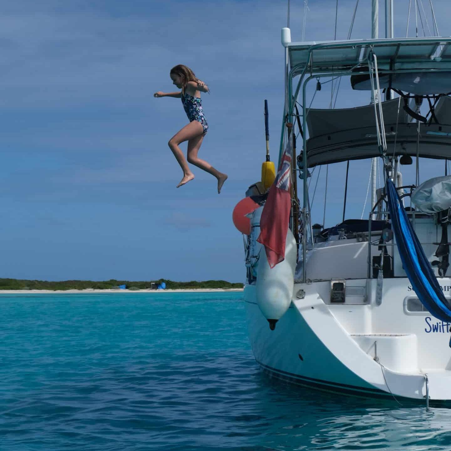 Sailing Swift Daughter Jumping off The Sailboat Anchored in Barbuda