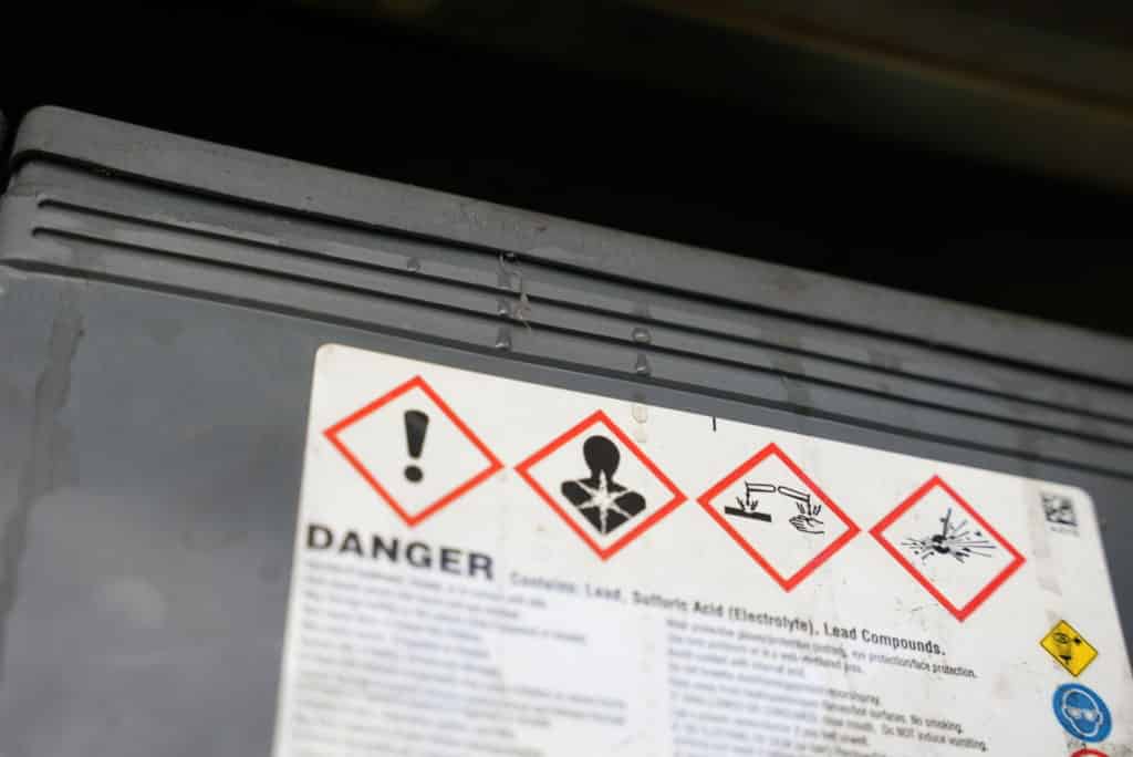 danger warning label on a lead-acid battery