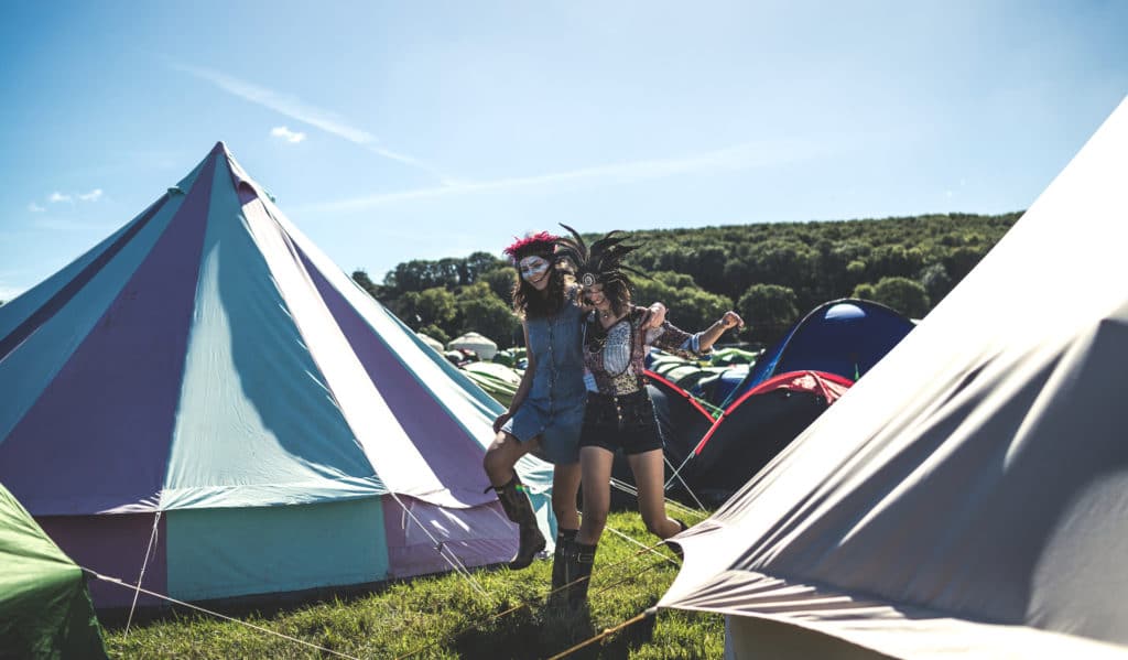 women wearing costumes while camping