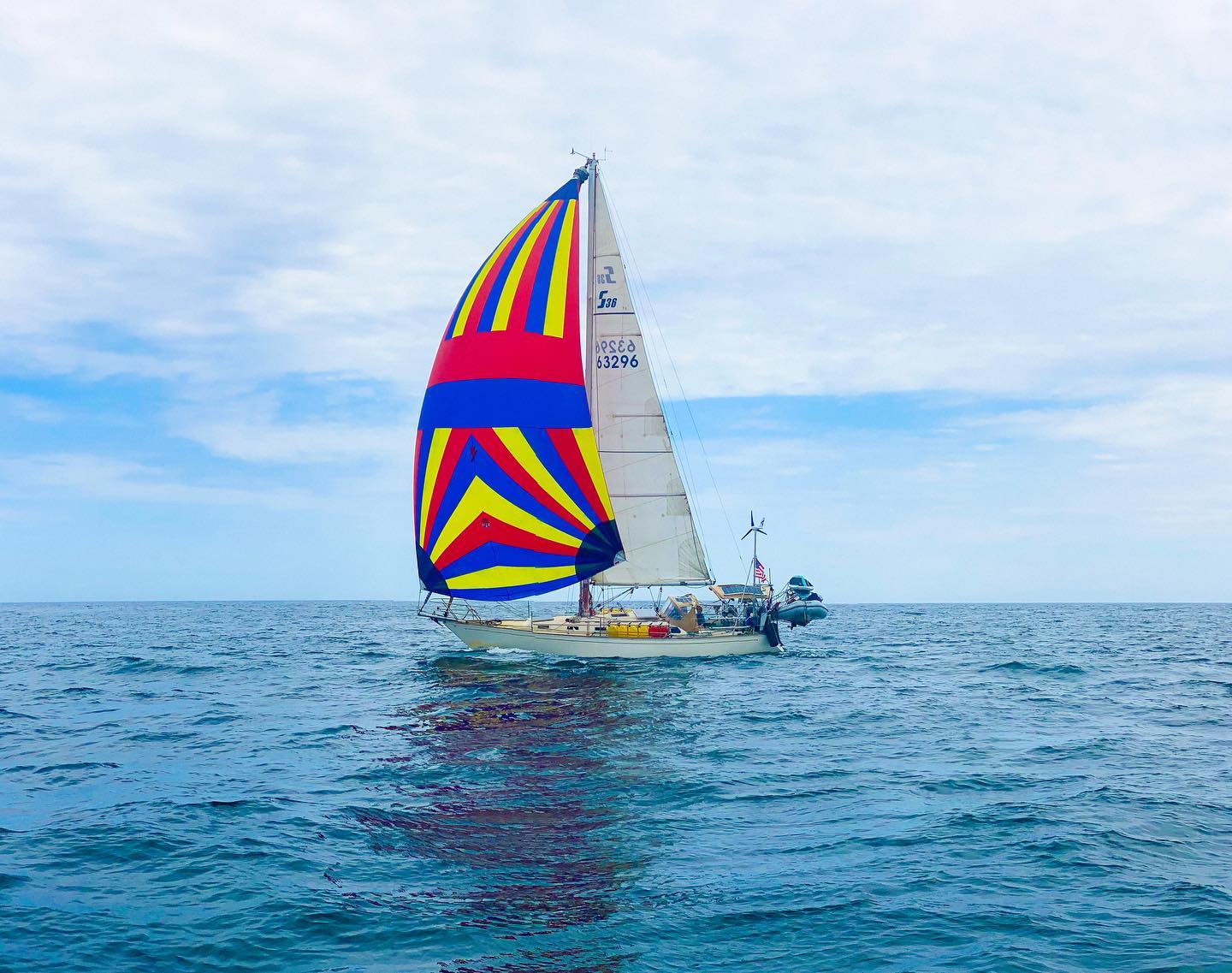 Calico Skies Sailing sailboat on the water