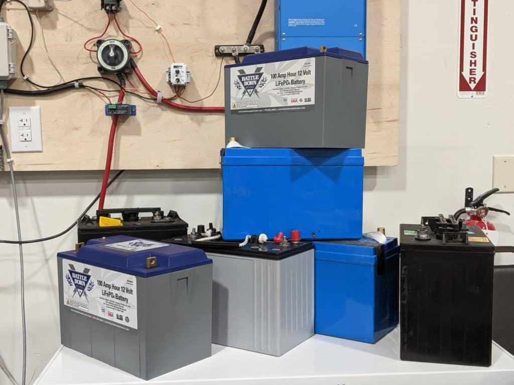 lead acid and lithium deep cycle batteries stacked