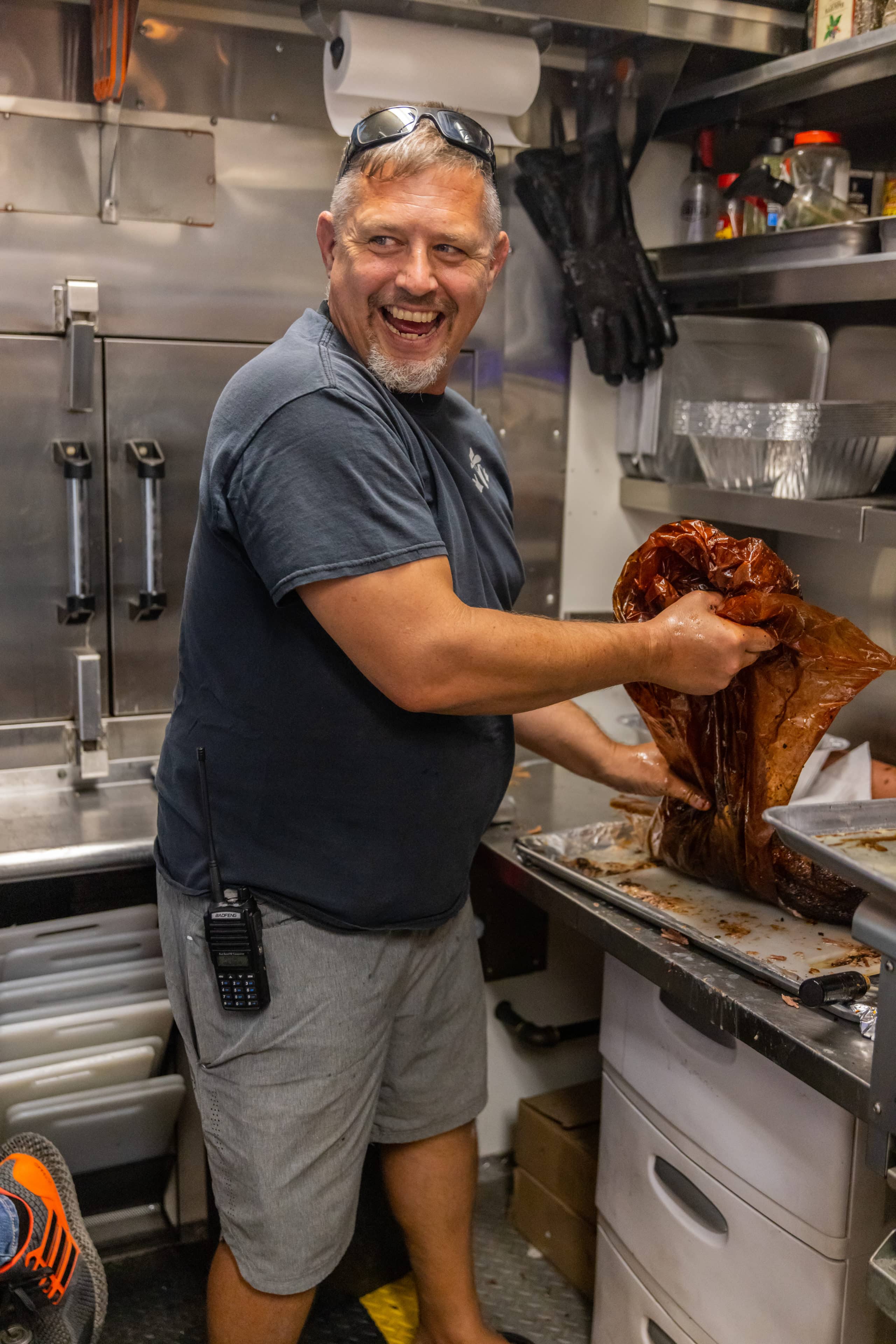 Jason Kleefish in Bandit BBQ Food Truck Prepping Meat