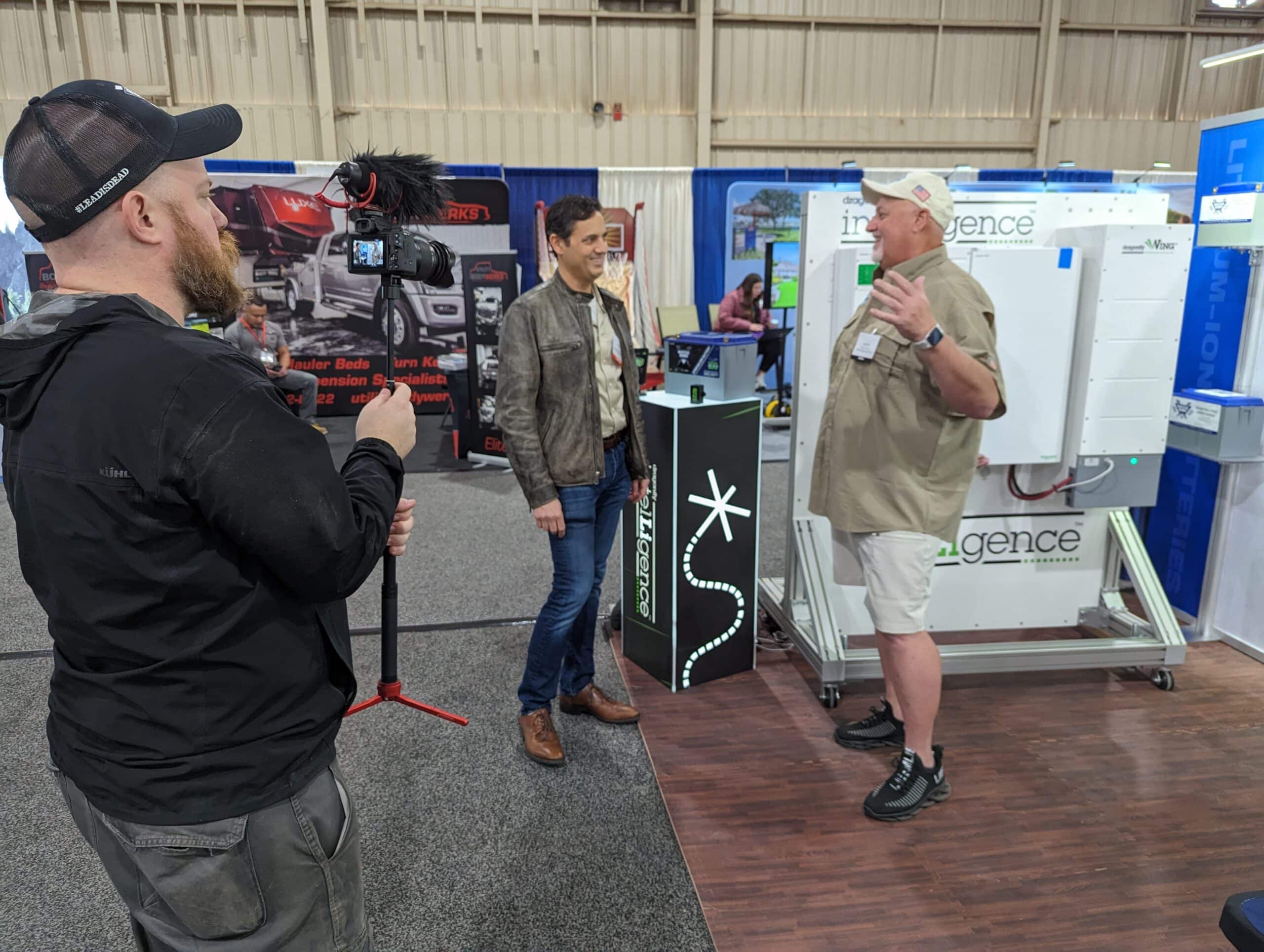 Geoff from My Bucket List Day Interviewing Denis at the Battle Born Batteries Booth at the RV SuperShow