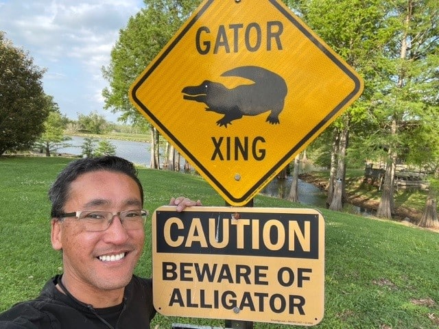 Stewart from RV Dreaming with Alligator Crossing Sign