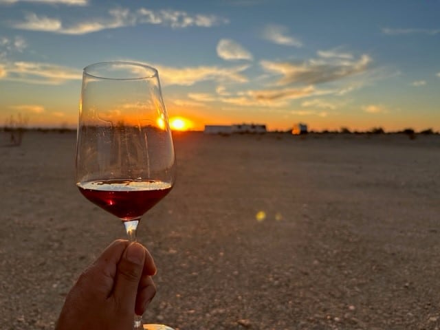 Stewart from RV Dreaming with a Glass of Wine at Sunset