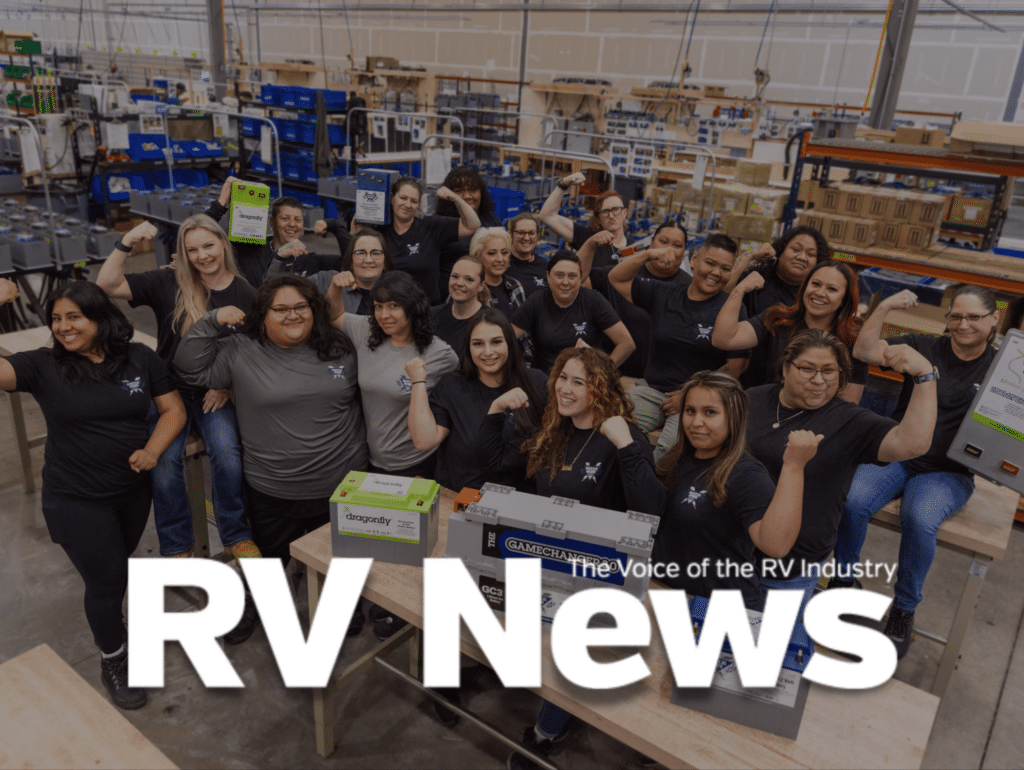 RV News Logo Over Battle Born Batteries team Members in the Warehouse