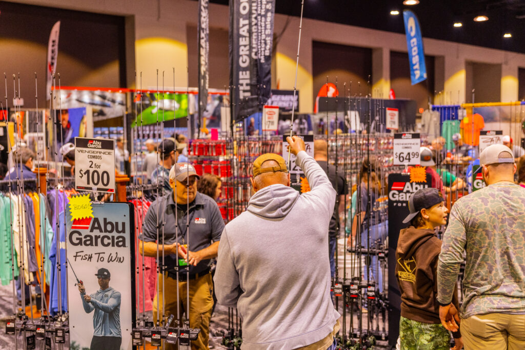 Attendees at the Bassmaster Classic 2022 check out merchandise at the outdoor expo