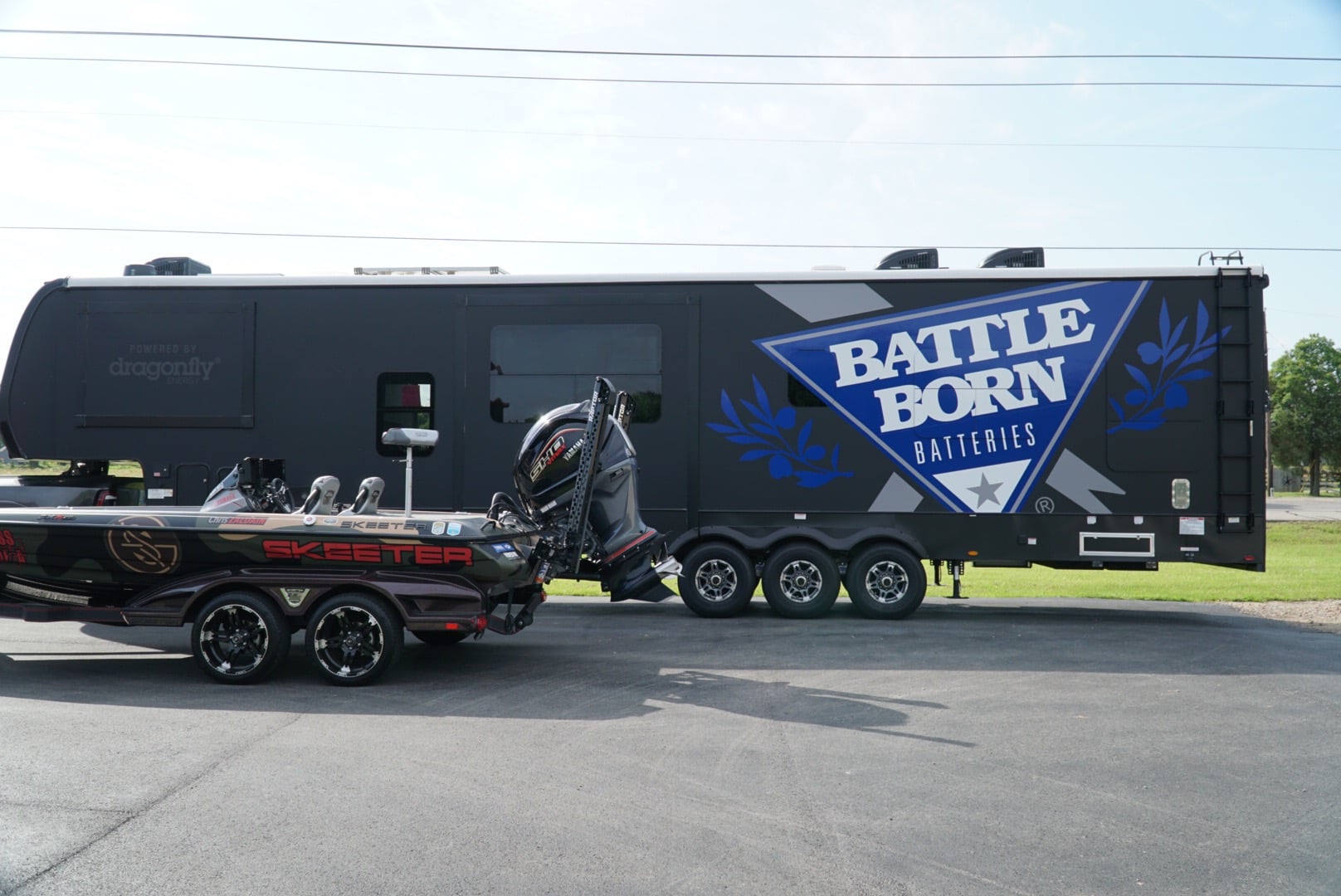 Angler Chris Zaldain's Keystone RV Toy Hauler with a large Battle Born Batteries logo on the side