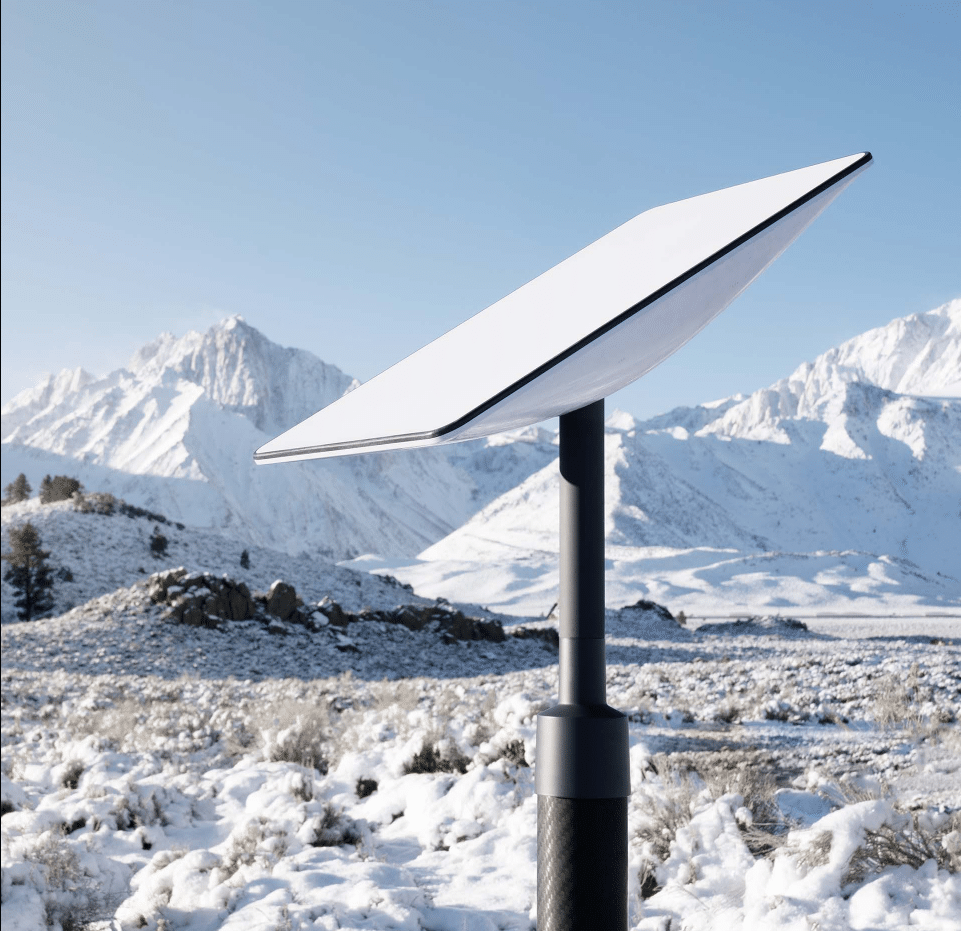 satellite dish in the middle of snowy mountains