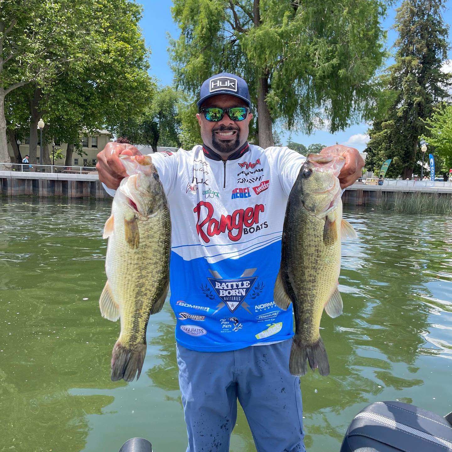 Professional Angler Darius Arberry Holding up 2 Bass