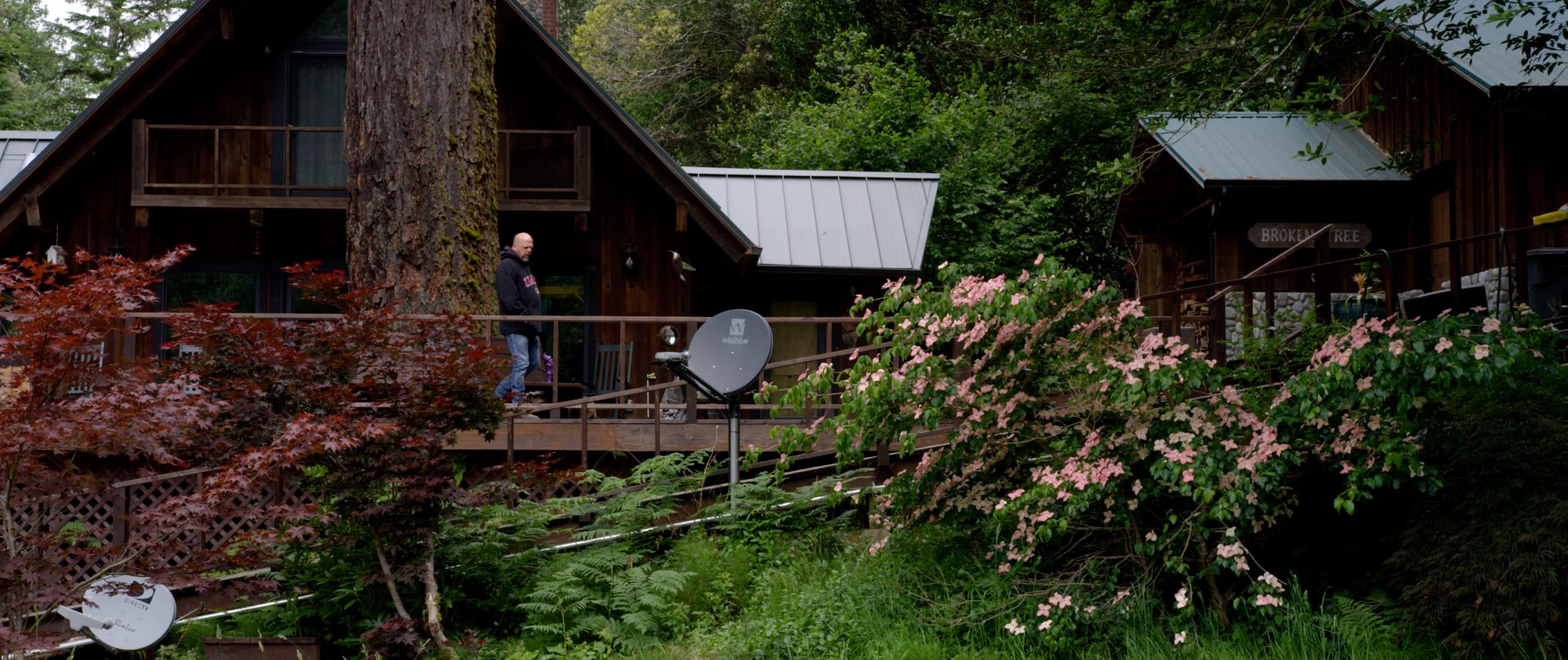 Rick Harrison walking on the porch of his off-grid home