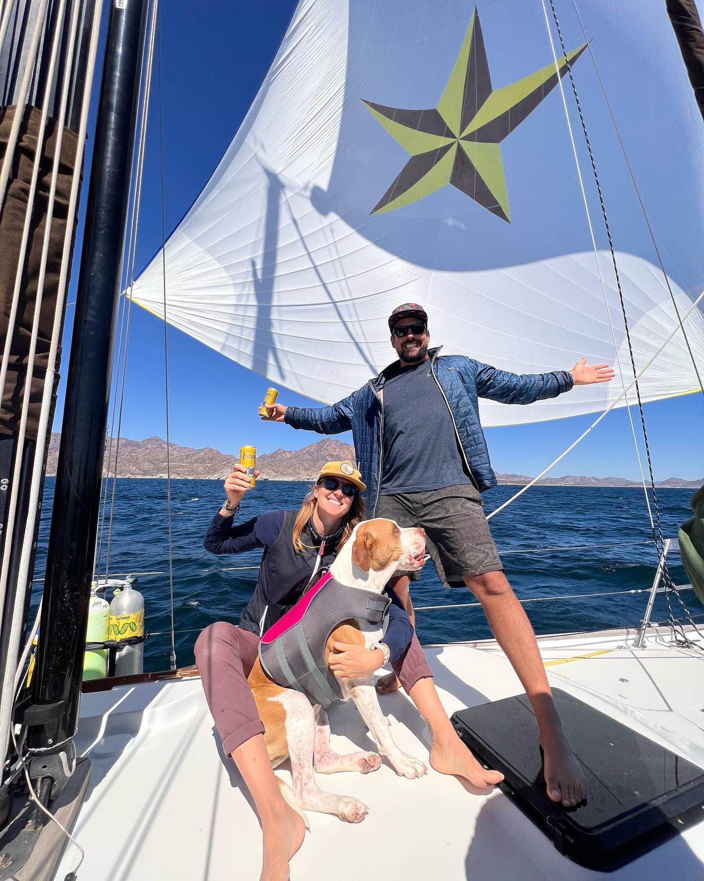 Brady, Blue, and Sharki on a sailboat