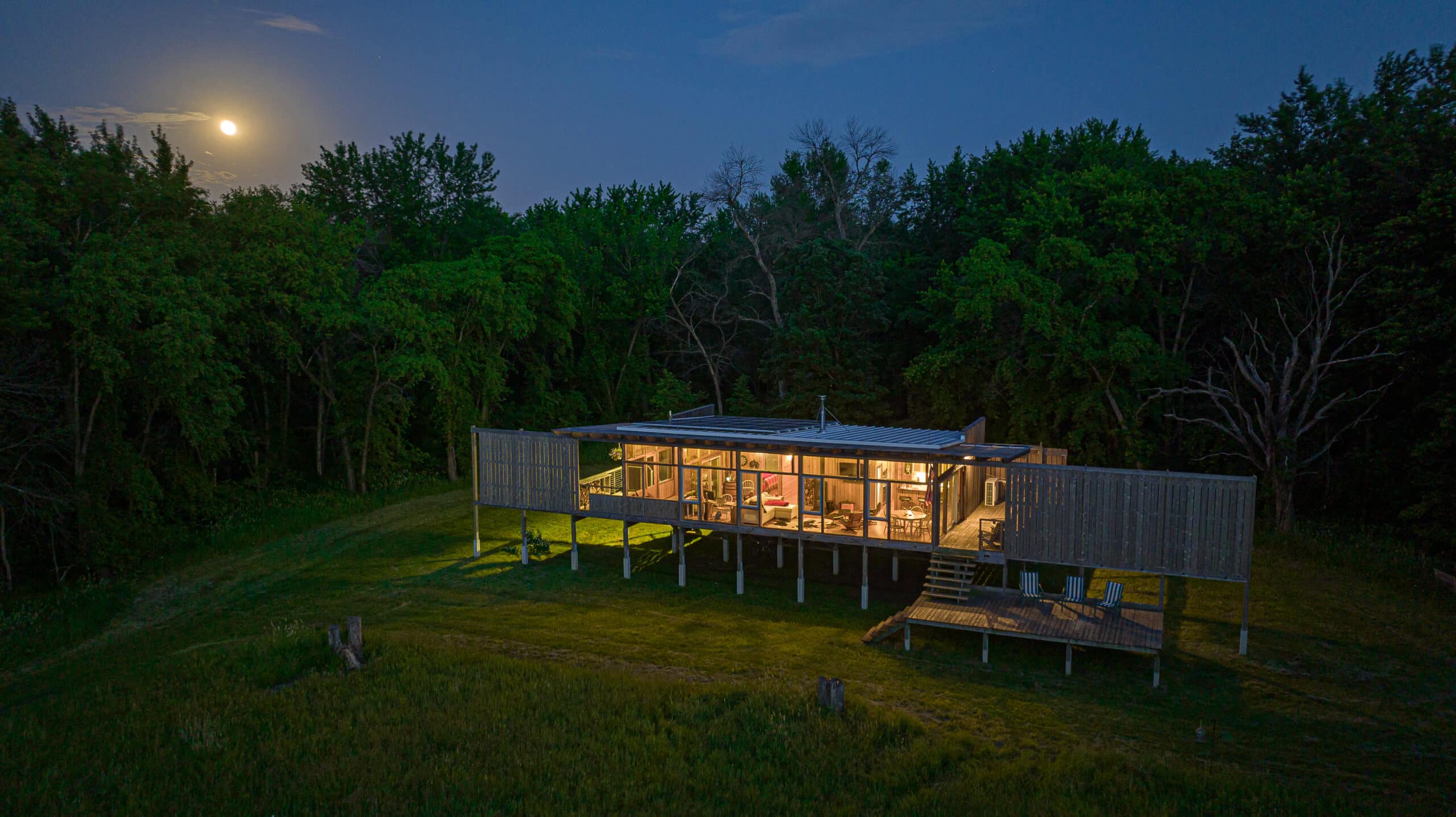 Steven Ristings Off Grid Home lit up at night