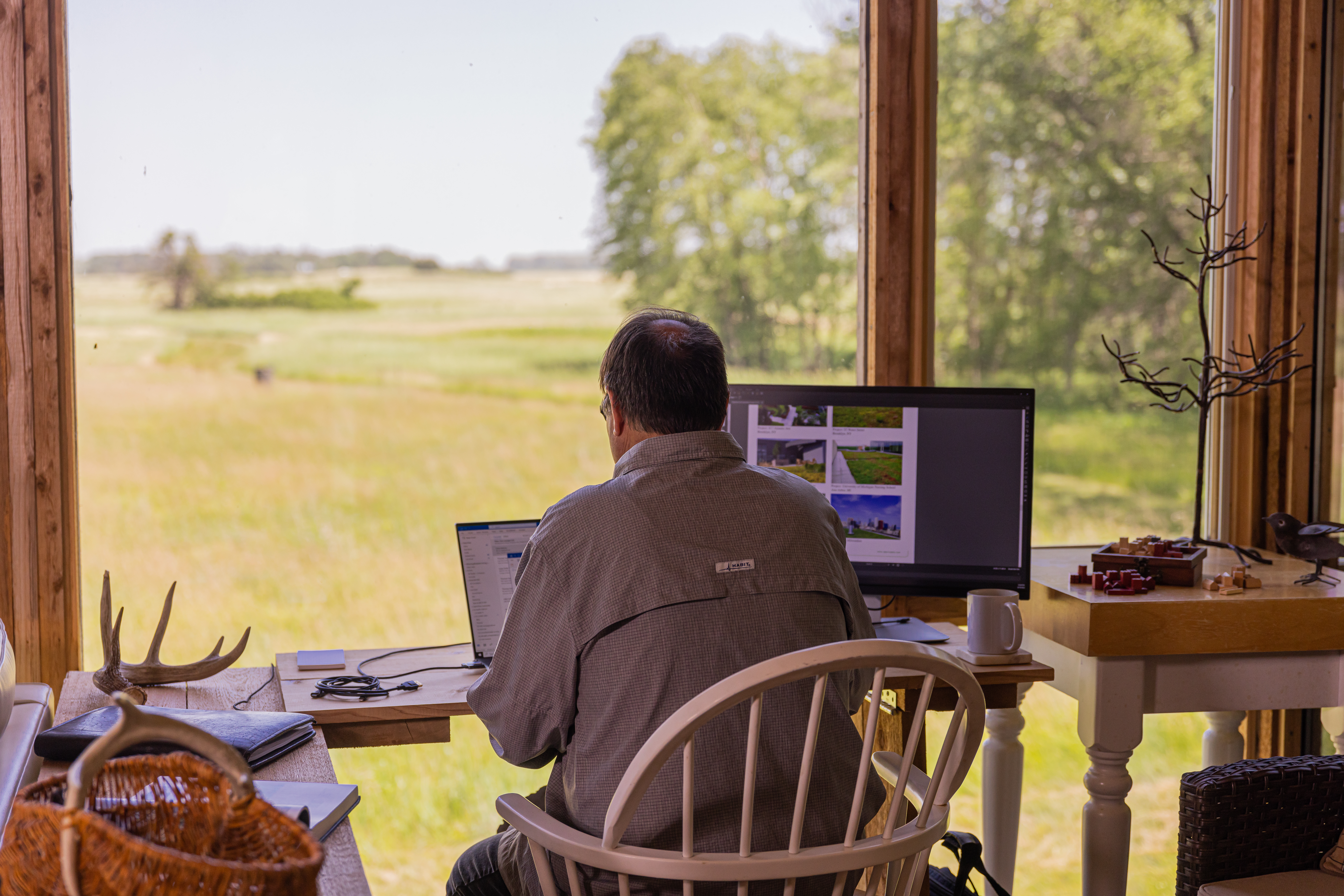 Steven Ristings Off Grid Home working at his desk