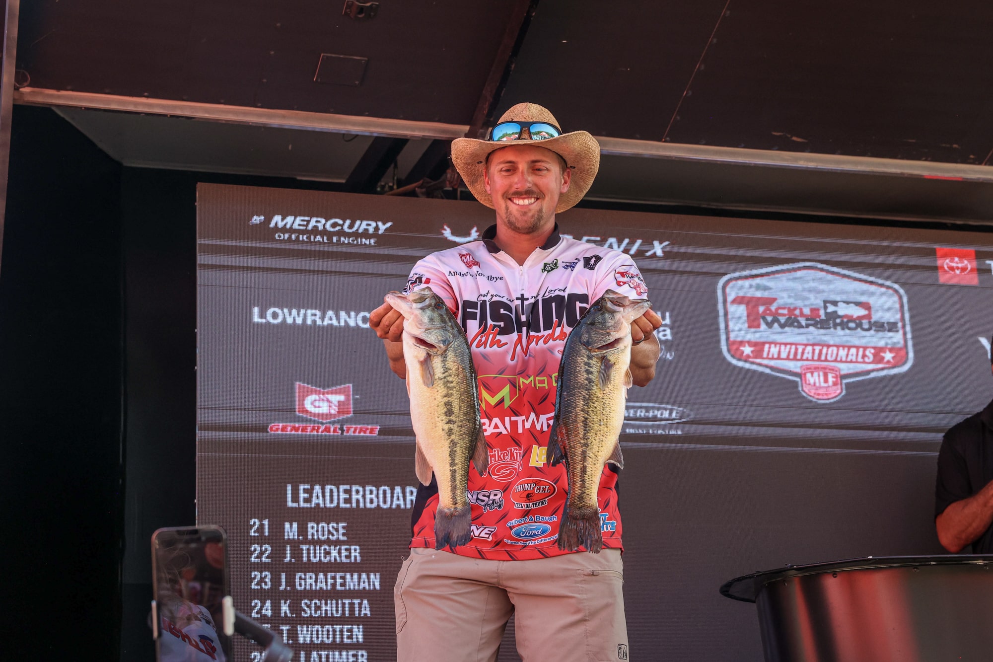 Andrew Nordbye Competing in MLF, holding 2 bass that he caught