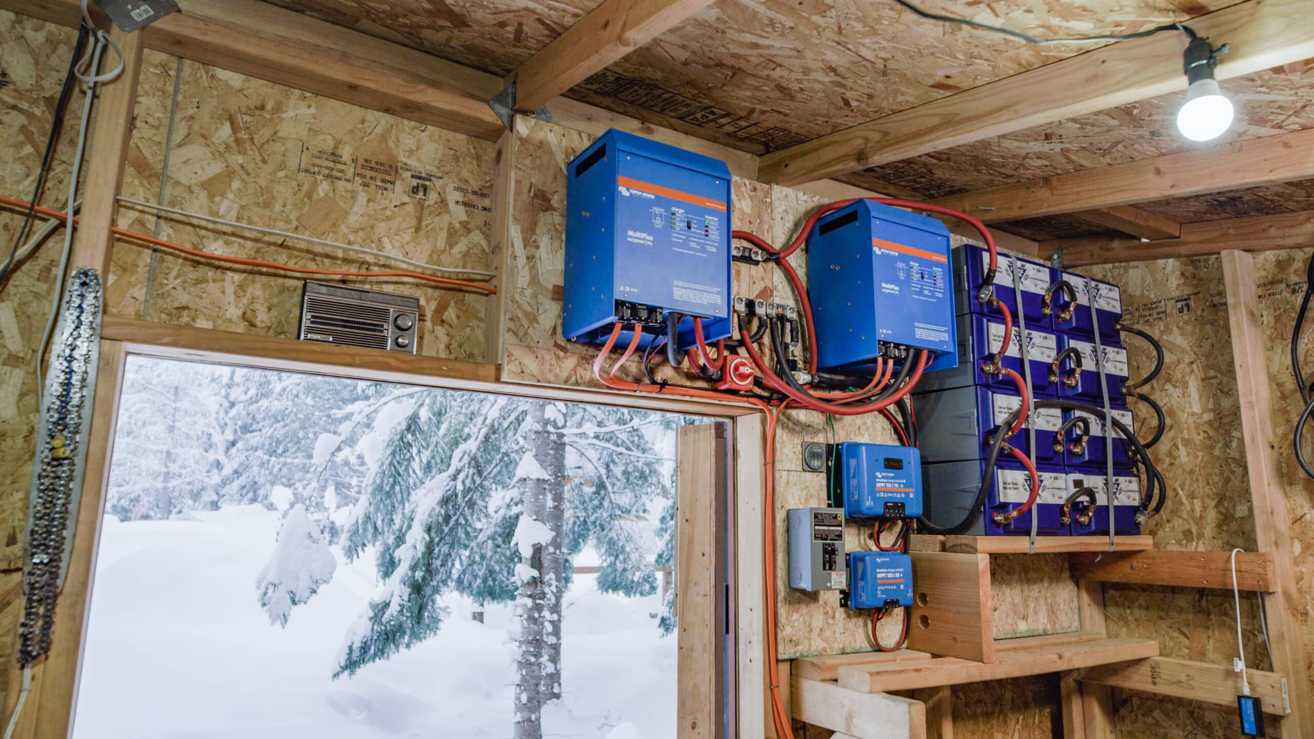An off-grid battery storage system in mounted in an off-grid cabin