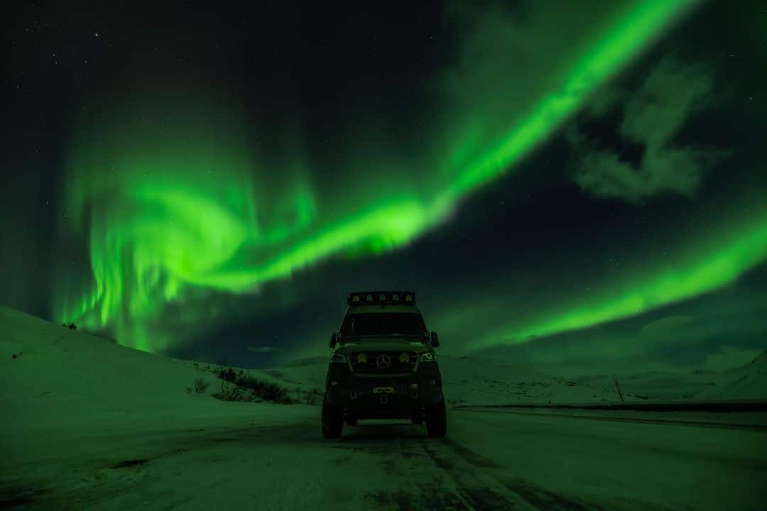 Living the Van Life in the Arctic with the Aurora Borealis behind