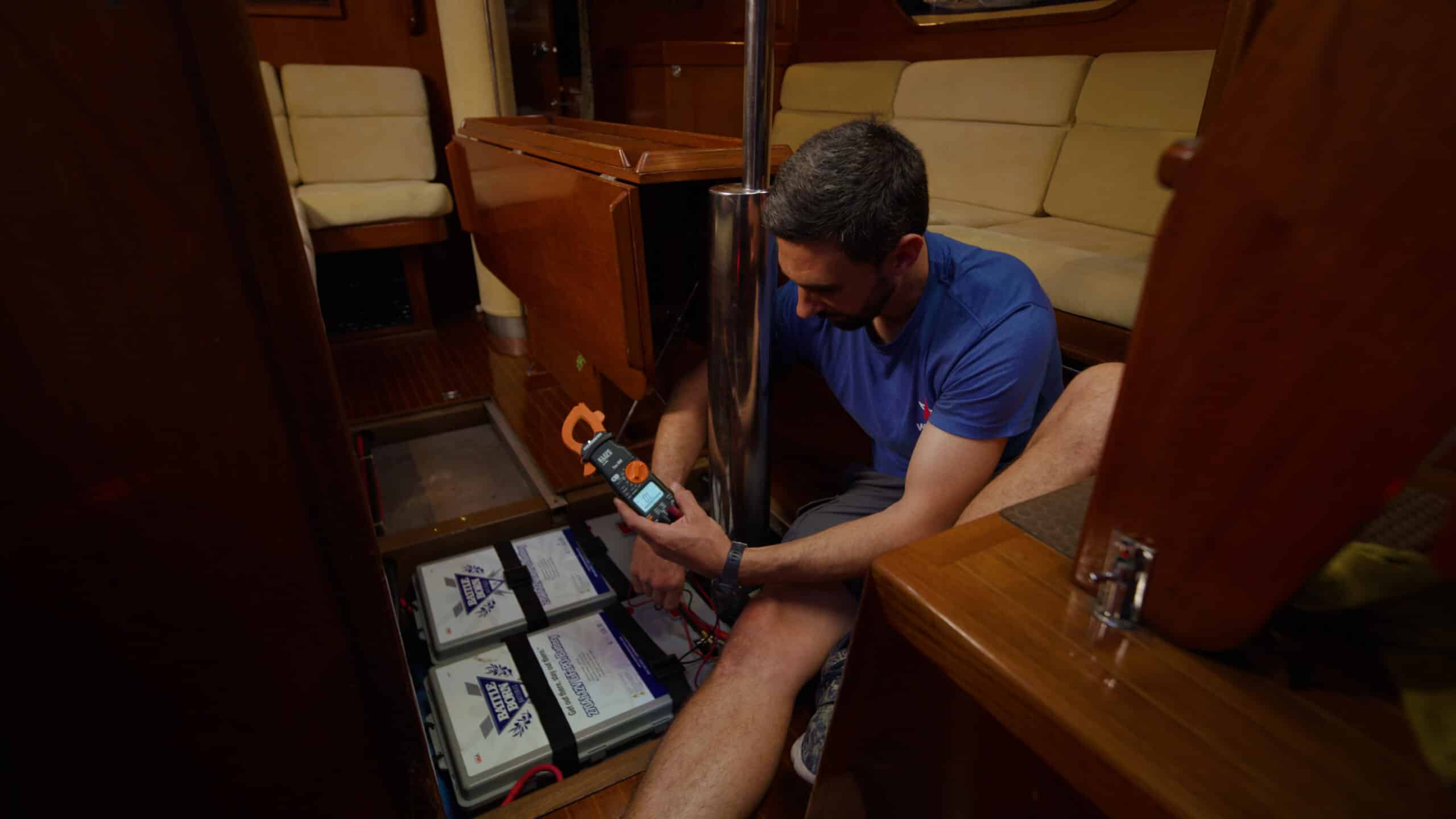 Connor Smith using a Multimeter on Battle Born Batteries