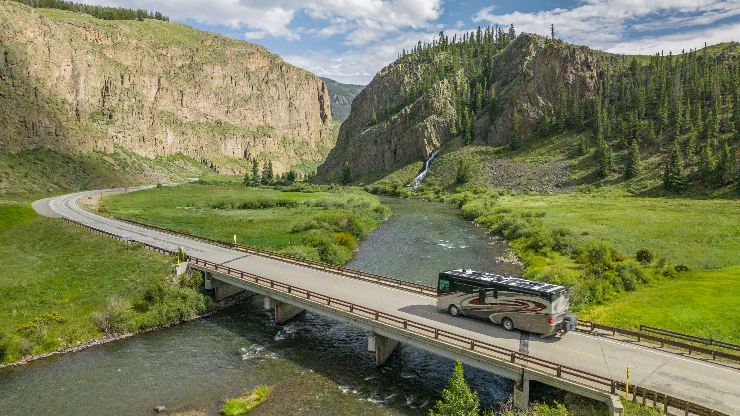 RV driving over a bridge