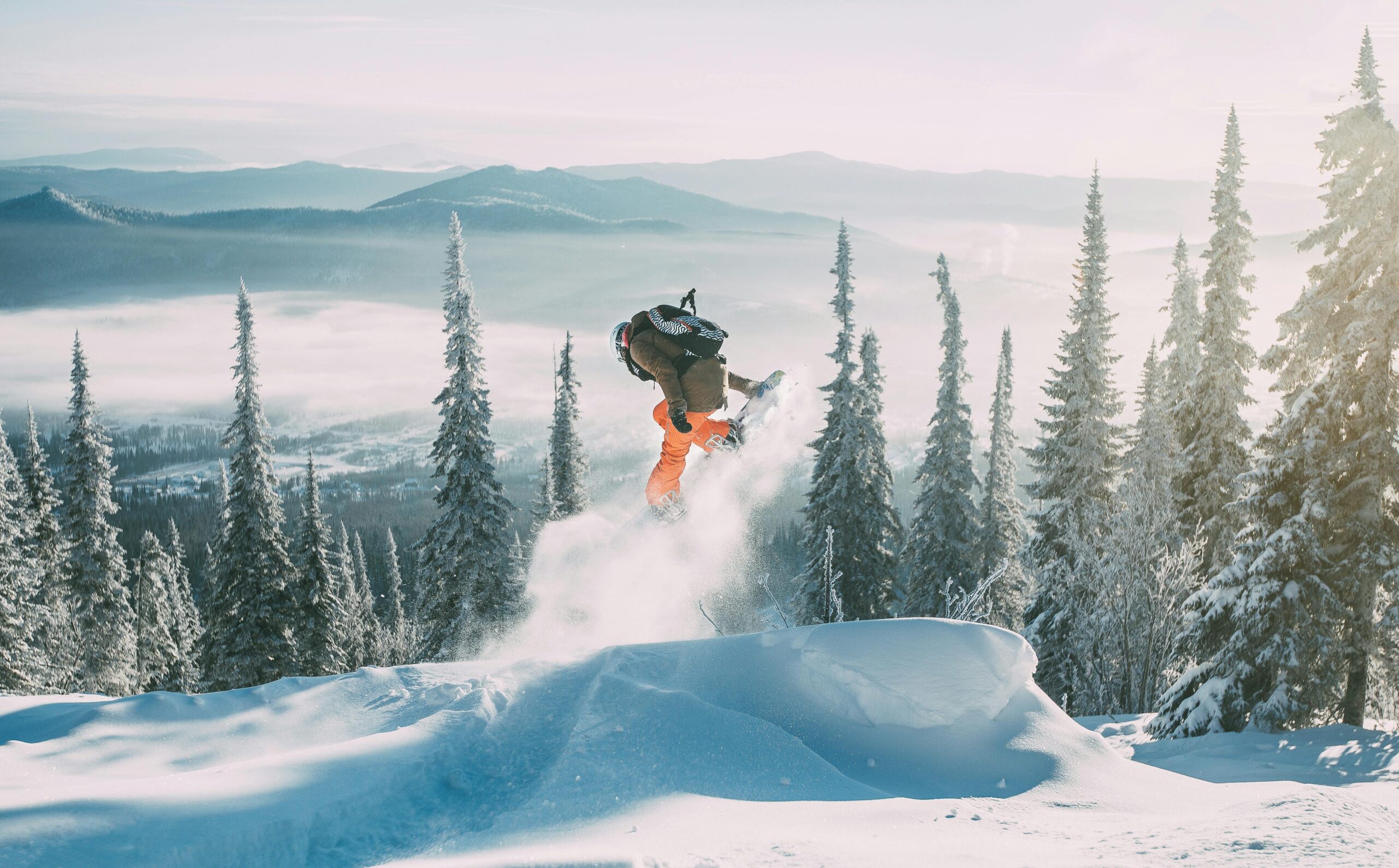 snowboarder going off a jump