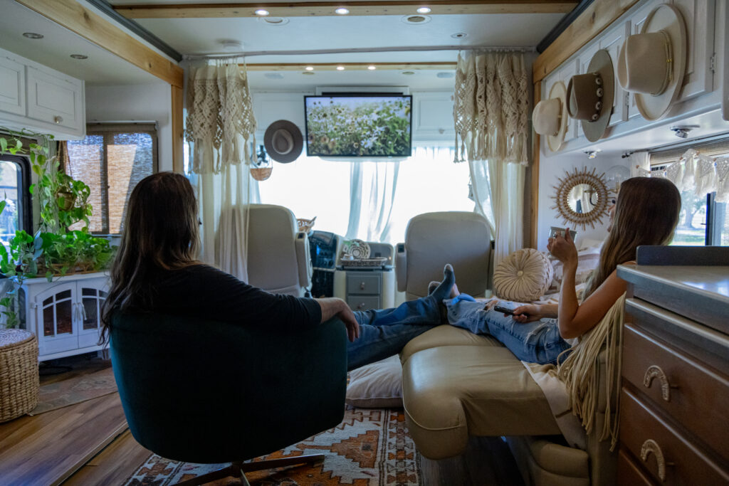 couple watching a movie in their lithium battery powered rv